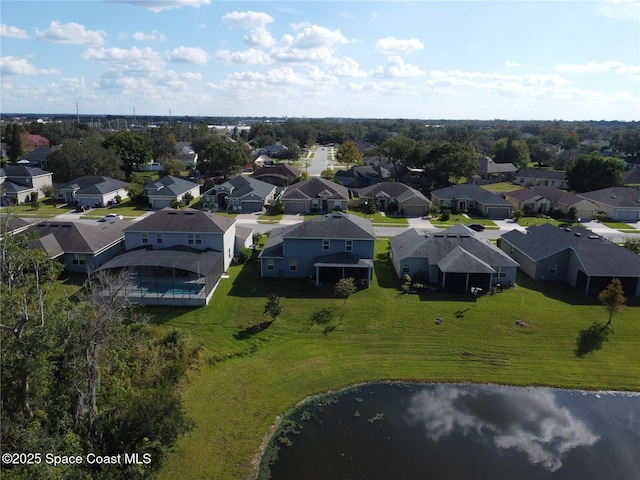 bird's eye view with a residential view and a water view