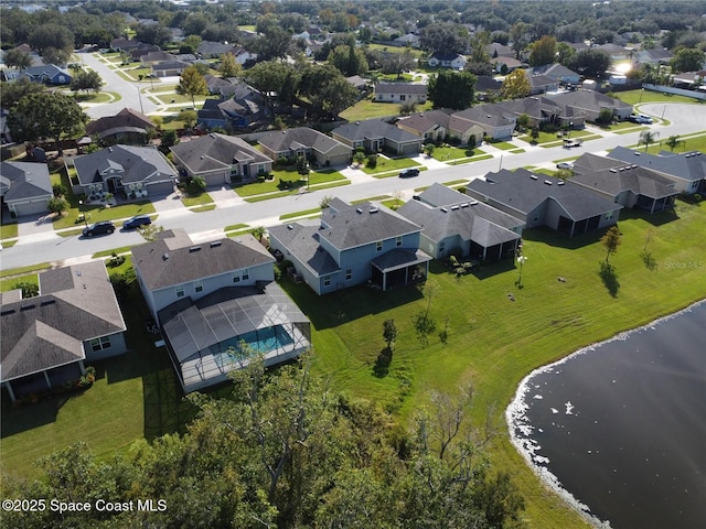 bird's eye view with a residential view and a water view