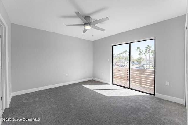 carpeted empty room with a ceiling fan and baseboards