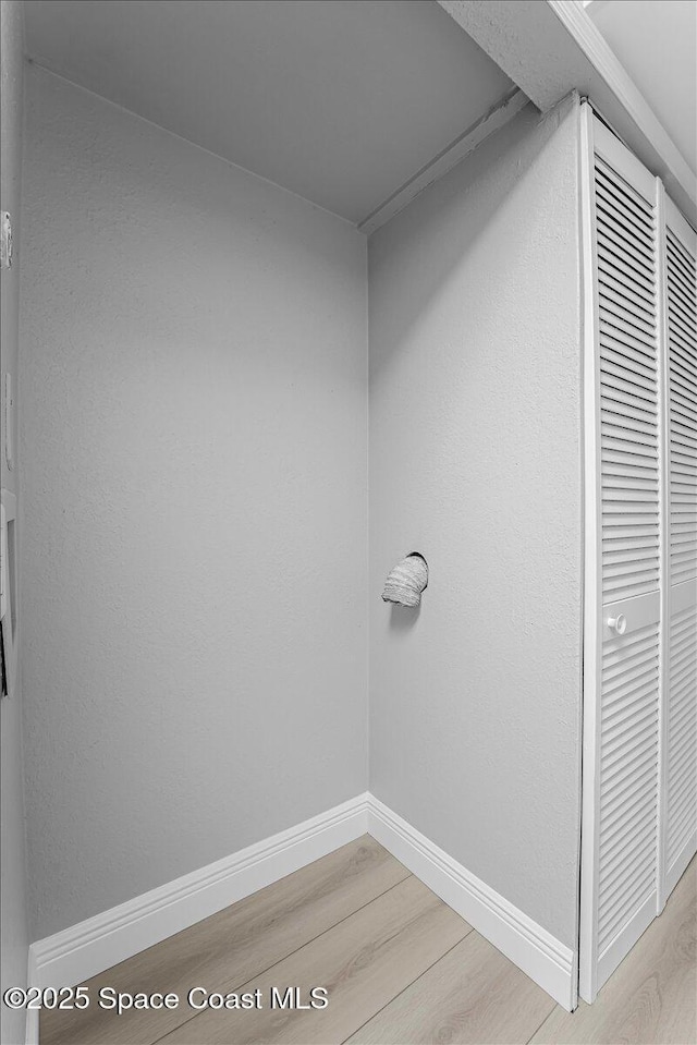 details featuring baseboards and wood finished floors