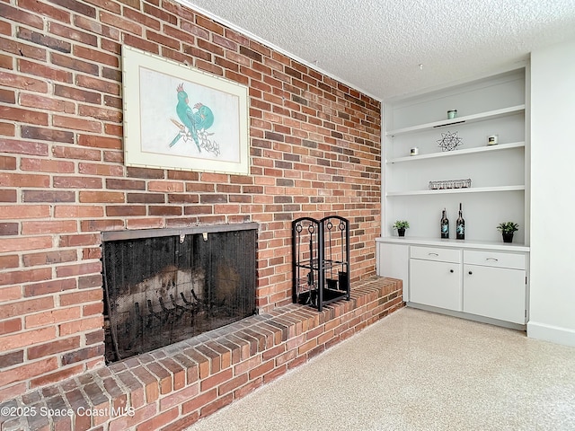 living room featuring a textured ceiling and a brick fireplace