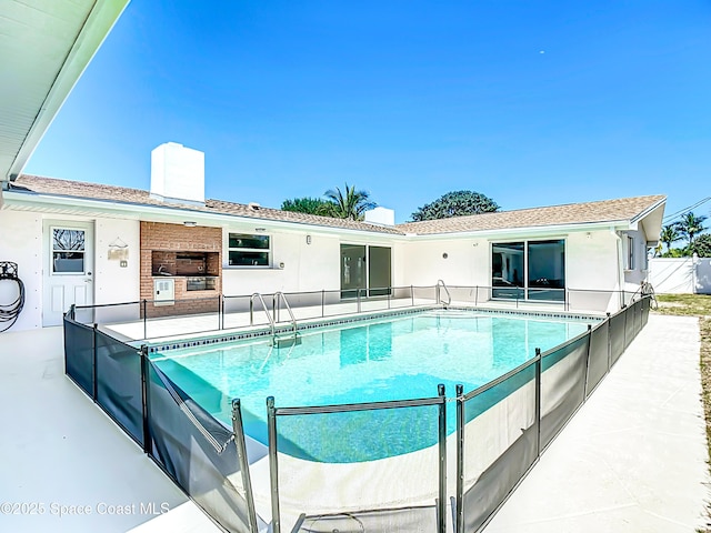 view of pool with a fenced in pool, fence, and a patio area