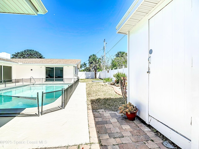 view of pool with a fenced in pool, a patio, and a fenced backyard