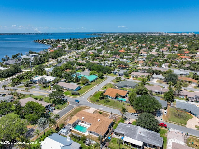 drone / aerial view with a water view