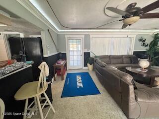 interior space featuring a ceiling fan