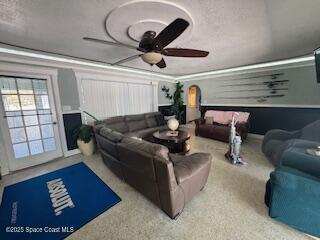 home theater room with ceiling fan