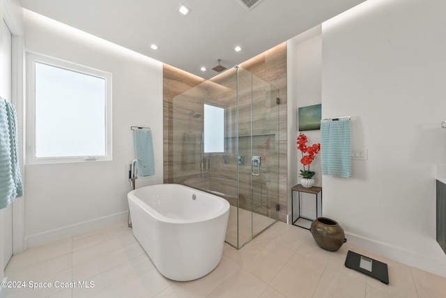 full bath featuring a stall shower, recessed lighting, tile patterned flooring, baseboards, and a soaking tub