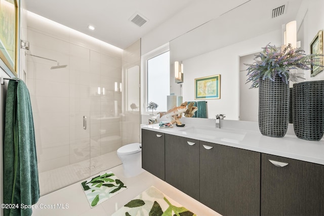 full bathroom with visible vents, toilet, a stall shower, and vanity