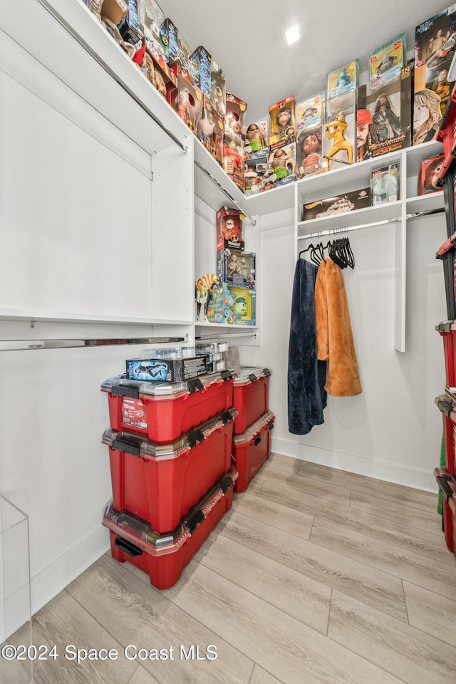 spacious closet with wood finished floors