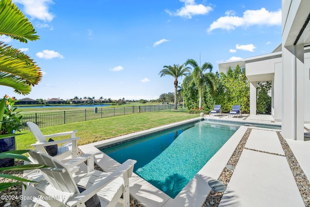 view of pool featuring a patio, a yard, a fenced backyard, and a fenced in pool