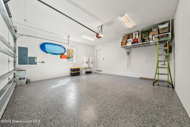 garage featuring electric panel, a garage door opener, and water heater