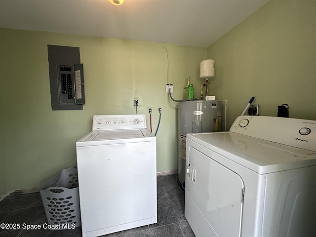 washroom with laundry area, electric panel, washing machine and dryer, and electric water heater