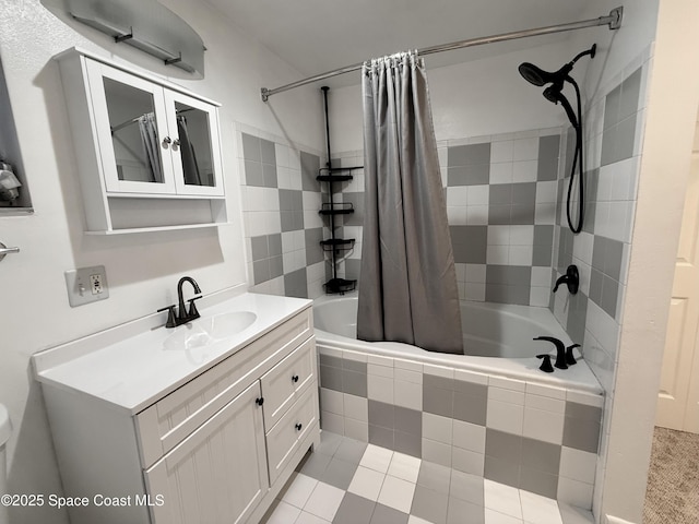 full bath with vanity and tiled shower / bath