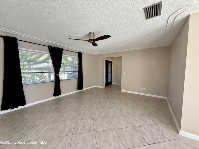 unfurnished room featuring visible vents, a ceiling fan, a textured ceiling, light tile patterned flooring, and baseboards