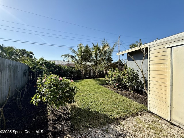 view of yard with a fenced backyard