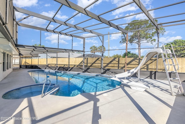 view of pool with a fenced in pool, a water slide, a fenced backyard, a lanai, and a patio area