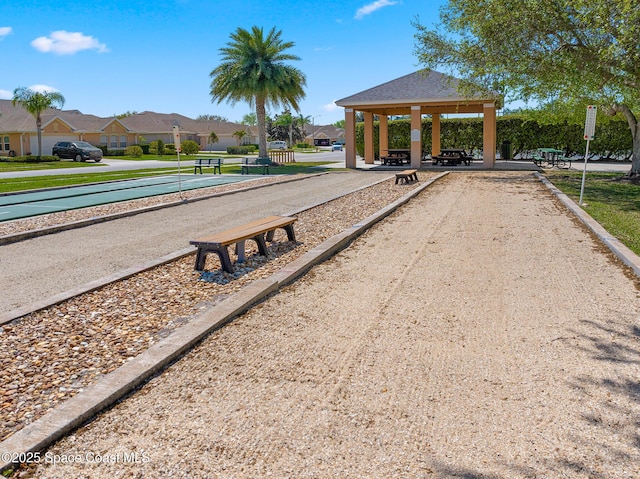 surrounding community with a gazebo and a residential view