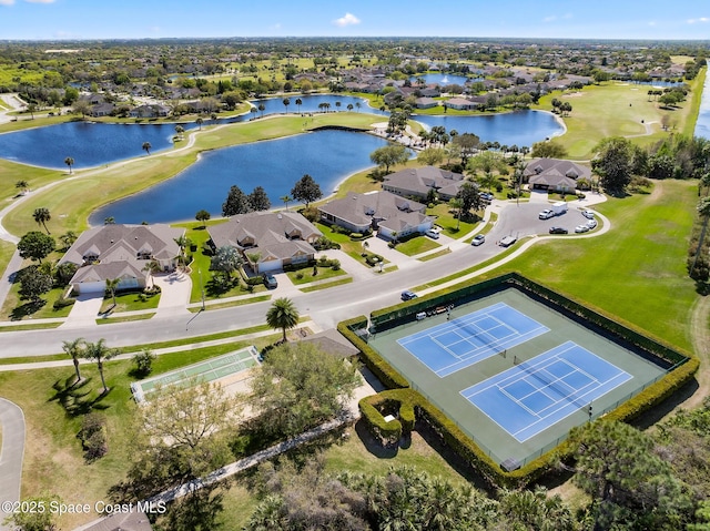 birds eye view of property featuring a residential view, view of golf course, and a water view