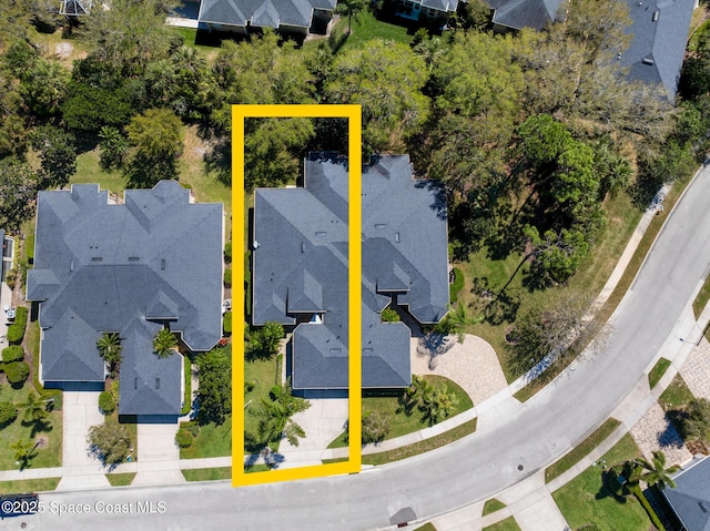 birds eye view of property with a residential view