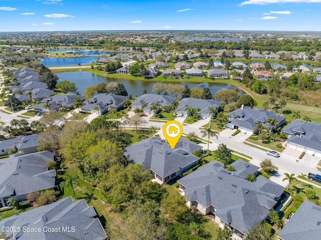 aerial view featuring a residential view and a water view