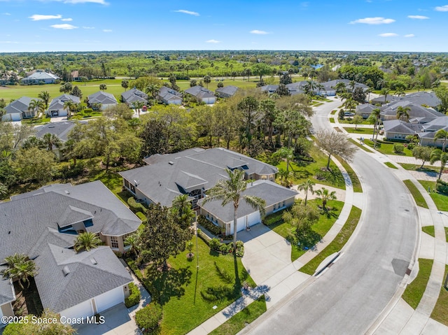 birds eye view of property with a residential view