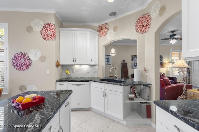 kitchen with a sink, a ceiling fan, white dishwasher, and crown molding