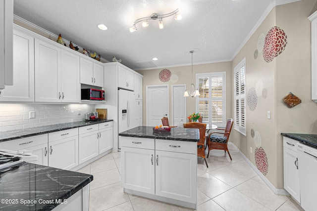 kitchen featuring ornamental molding, tasteful backsplash, white cabinetry, white appliances, and light tile patterned flooring