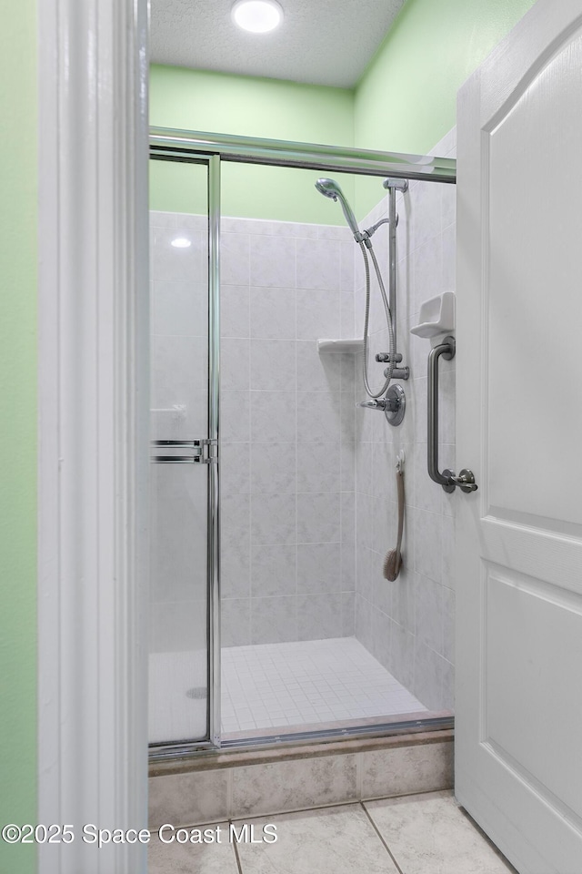 full bath with a shower stall