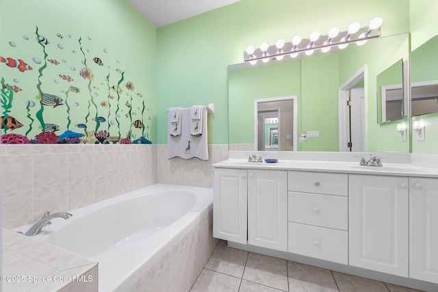 full bath with tile patterned flooring, double vanity, a bath, and a sink