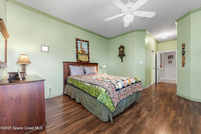 bedroom with ceiling fan, baseboards, ornamental molding, wood finished floors, and a textured ceiling