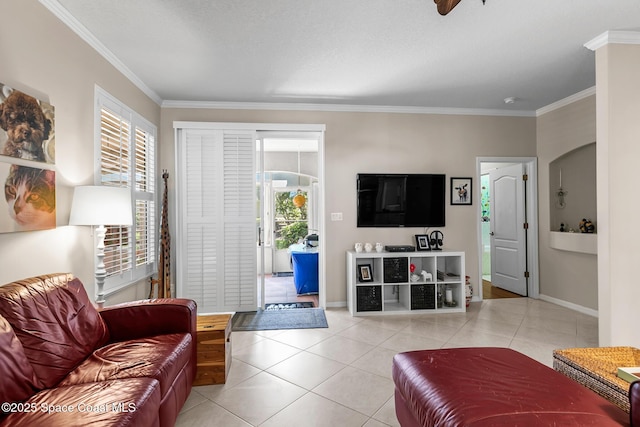 living area with light tile patterned flooring, crown molding, and baseboards