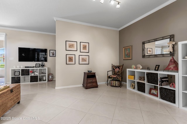 sitting room with tile patterned floors, baseboards, and ornamental molding