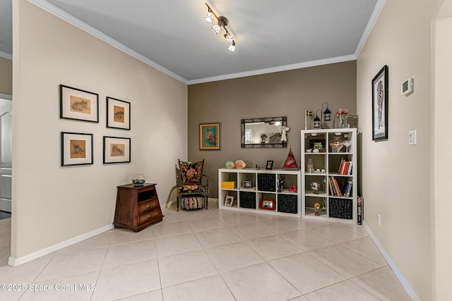 living area featuring track lighting, light tile patterned floors, baseboards, and ornamental molding