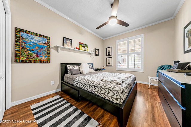 bedroom featuring ornamental molding, ceiling fan, baseboards, and wood finished floors