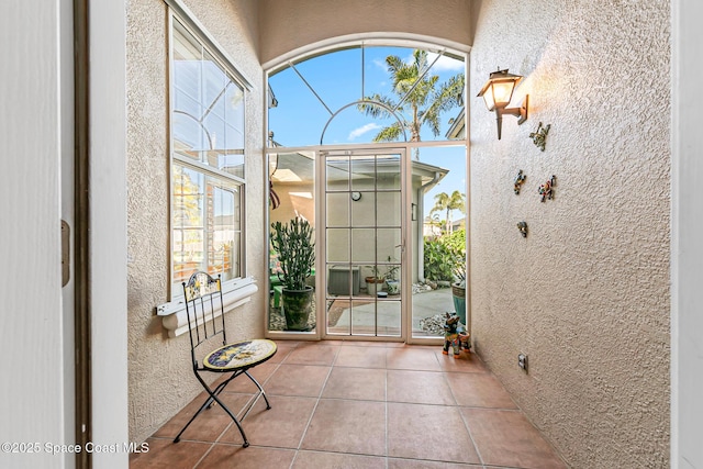 unfurnished sunroom with a healthy amount of sunlight