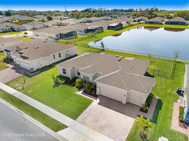 bird's eye view featuring a residential view and a water view