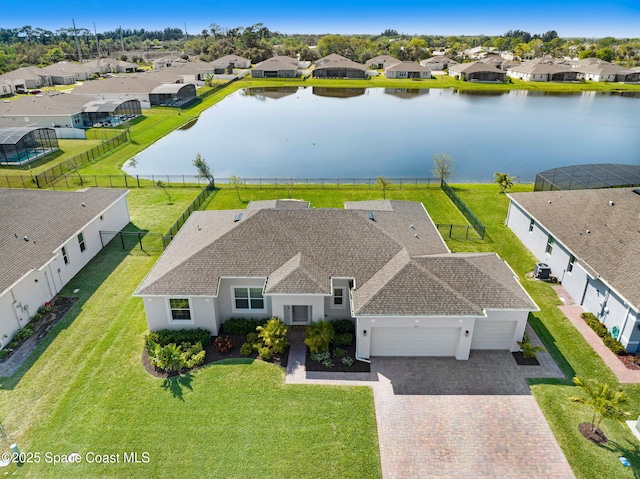 birds eye view of property featuring a residential view and a water view