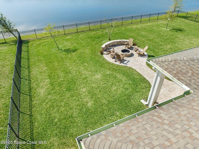 view of yard featuring a fire pit, a patio, and fence
