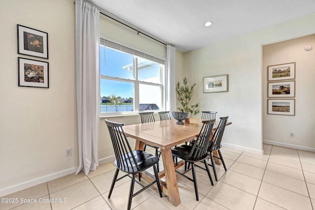 dining room featuring light tile patterned floors, recessed lighting, and baseboards