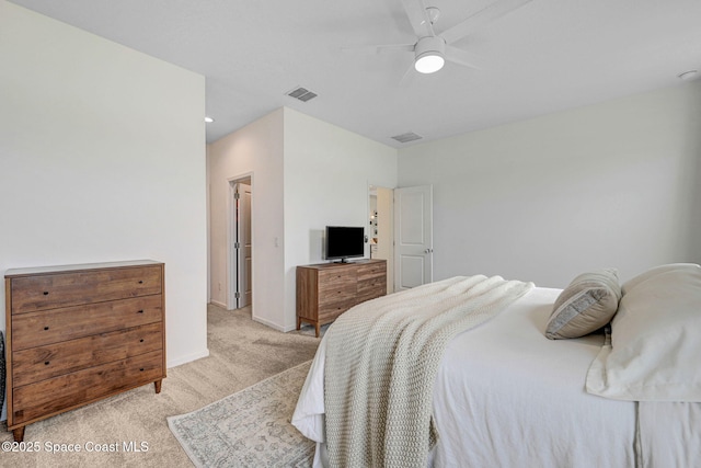 bedroom featuring visible vents, baseboards, light colored carpet, and a ceiling fan
