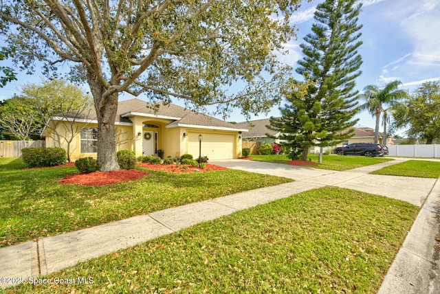 single story home featuring stucco siding, concrete driveway, a front yard, and fence