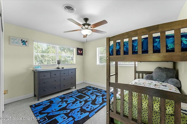 bedroom featuring visible vents, speckled floor, and baseboards