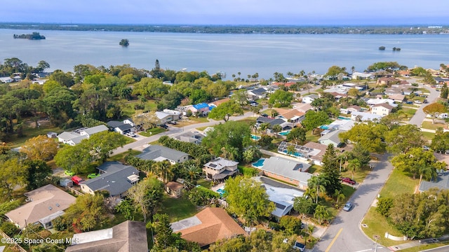 bird's eye view featuring a residential view and a water view