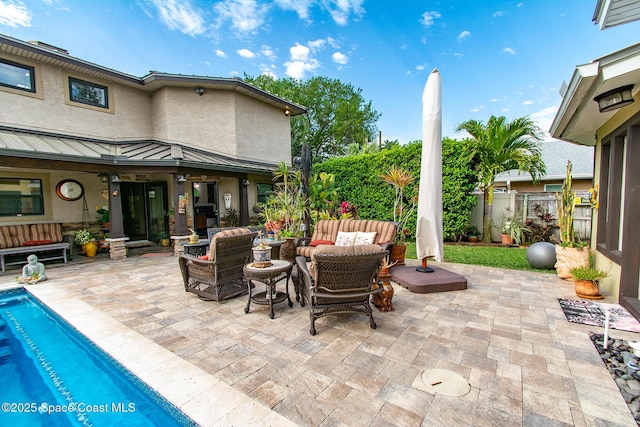 view of patio / terrace featuring a fenced in pool, outdoor lounge area, and fence