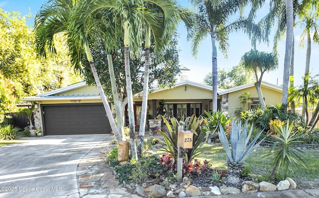 view of front of property with concrete driveway