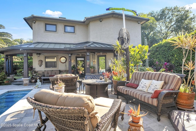 view of patio featuring an outdoor living space and an outdoor pool