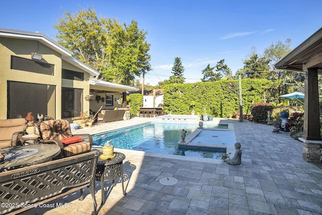 view of swimming pool featuring a fenced in pool, a patio, and outdoor lounge area