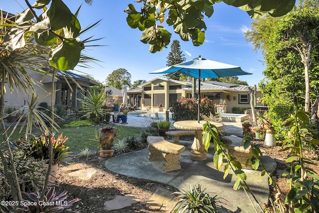 view of yard featuring an outdoor pool and a patio