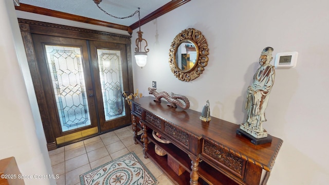 entryway featuring light tile patterned floors, french doors, and ornamental molding