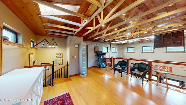 interior space featuring an inviting chandelier, wood finished floors, wooden ceiling, and vaulted ceiling